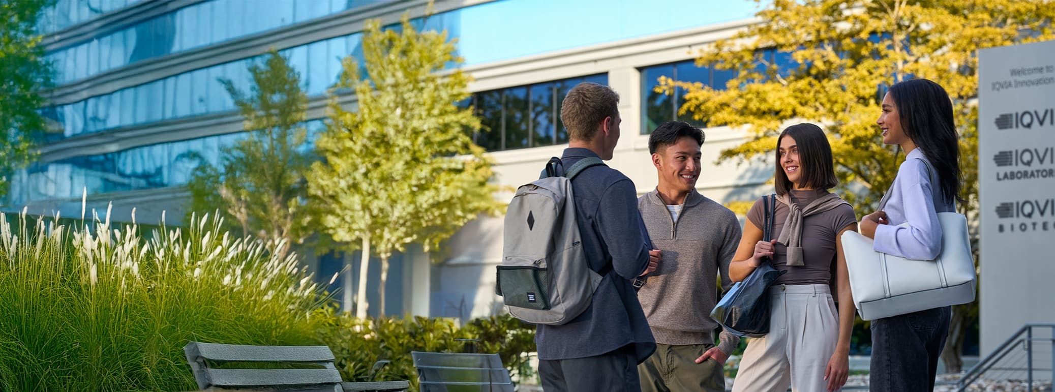 interns standing outside iqvia office talking